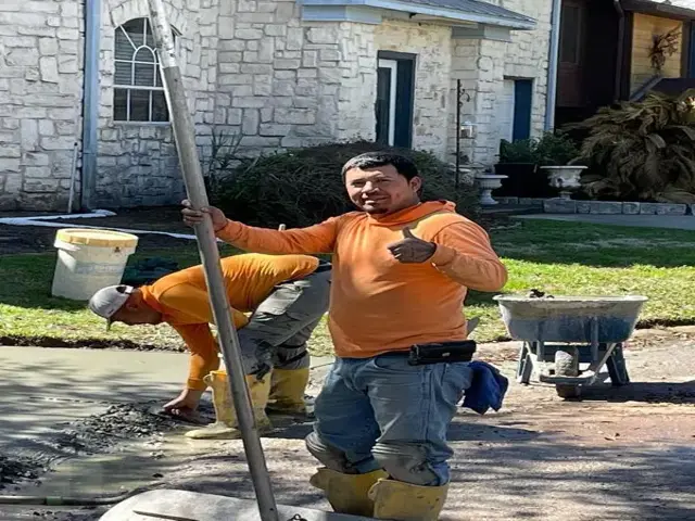 finishing concrete driveway and letting dry.